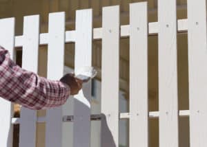 Man Painting Fence